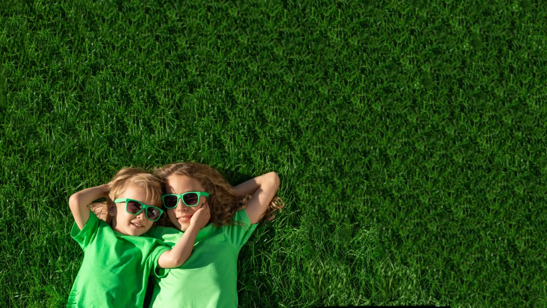 Kids playing on a beautiful green lawn